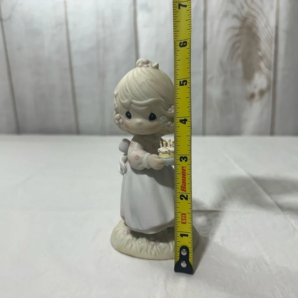 Precious Moment’s figurine titled “May Your Birthday Be A Blessing” from 1990